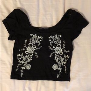 Black crop top with floral detail